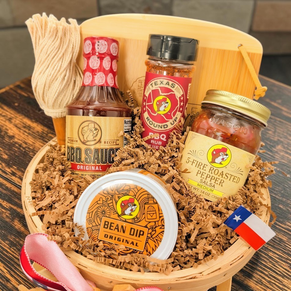 Texas barbecue gift assortment arranged in a wooden bushel basket